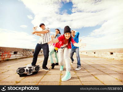 sport, dancing and urban culture concept - group of teenagers dancing