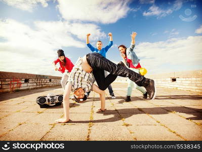 sport, dancing and urban culture concept - group of teenagers dancing