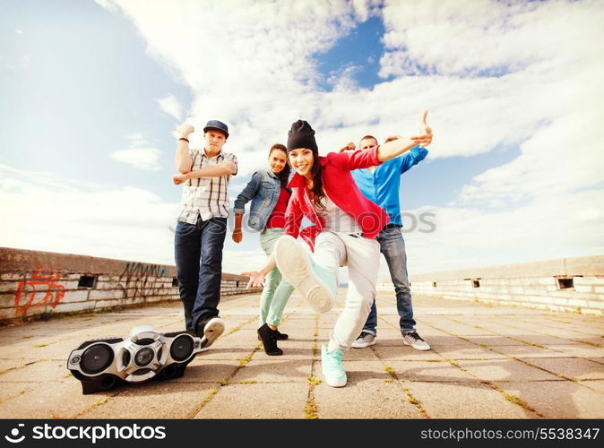 sport, dancing and urban culture concept - group of teenagers dancing