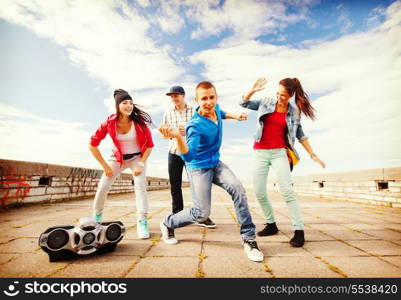 sport, dancing and urban culture concept - group of teenagers dancing