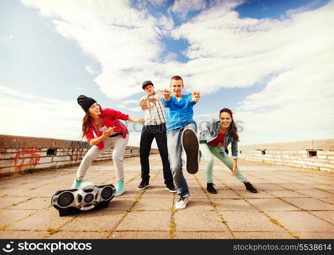 sport, dancing and urban culture concept - group of teenagers dancing