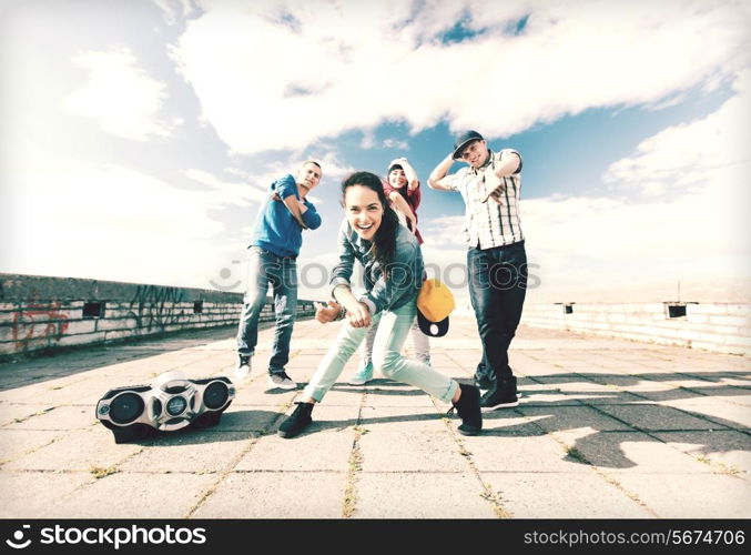 sport, dancing and urban culture concept - group of teenagers dancing