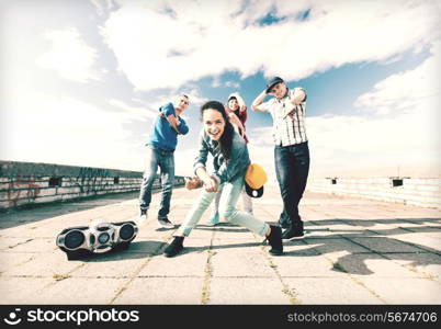 sport, dancing and urban culture concept - group of teenagers dancing