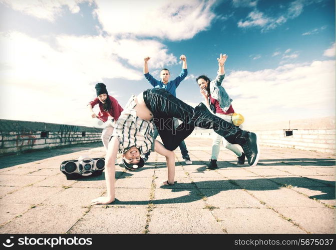 sport, dancing and urban culture concept - group of teenagers dancing