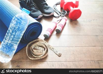 Sport equipments on wood floor, Working out concept