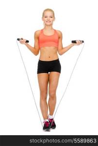 sport, excercise and healthcare - smiling sporty woman with skipping rope
