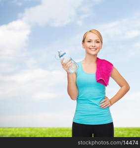 sport, excercise and healthcare - sporty woman with pink towel and water bottle