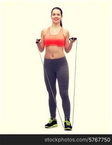 sport, excercise and healthcare - sporty woman with skipping rope