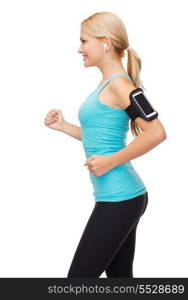 sport, excercise, technology, internet and healthcare - sporty woman running and listening to music from smartphone