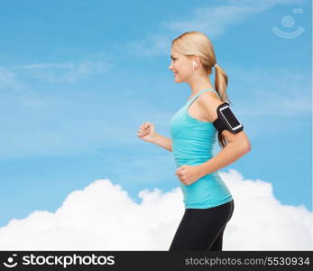 sport, excercise, technology, internet and healthcare - sporty woman running and listening to music from smartphone