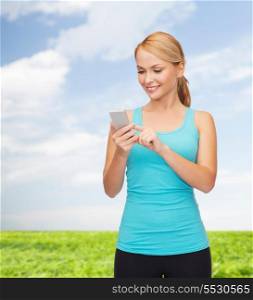 sport, excercise, technology, internet and healthcare - sporty woman with smartphone