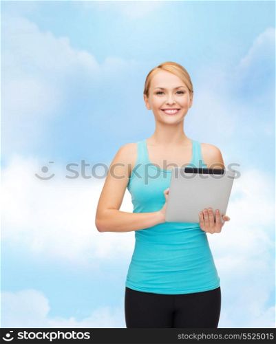 sport, excercise, technology, internet and healthcare - sporty woman with tablet pc