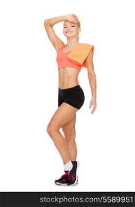 sport, exercise and healthcare - smiling sporty woman with towel wiping of sweat