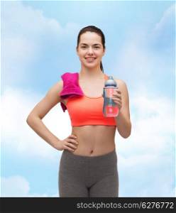 sport, exercise and healthcare - sporty woman with pink towel and water bottle