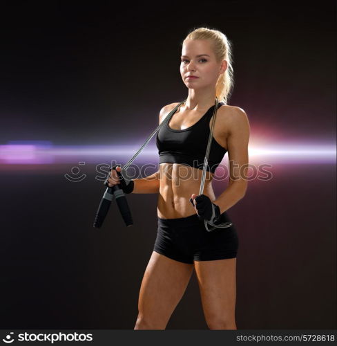 sport, exercise and healthcare - sporty woman with skipping rope