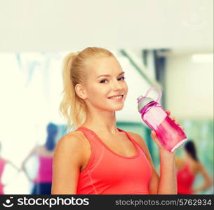 sport, exercise and healthcare - sporty woman with water bottle