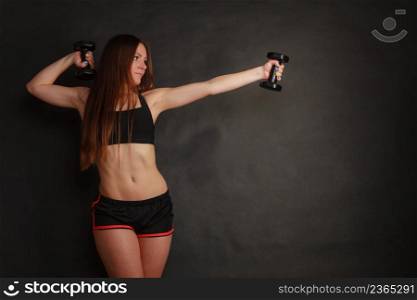 Sport exercise and wellbeing. Young woman with healthy lifestyle train with dumbbells gym.. Young woman stretch in sportswear use dumbbells.