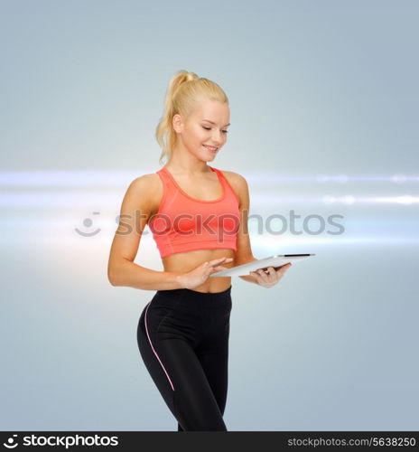 sport, exercise, technology, internet and healthcare concept - smiling sporty woman with tablet pc computer