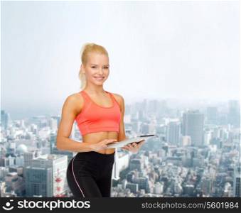 sport, exercise, technology, internet and healthcare - smiling sporty woman with tablet pc computer