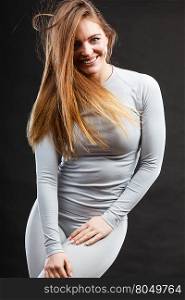Sport fit woman in thermal clothes.. Beauty seducive shape fit body concept. Attractive girl posing. Youthful smiling lady presenting thermoactive clothing showing fitness fashion.