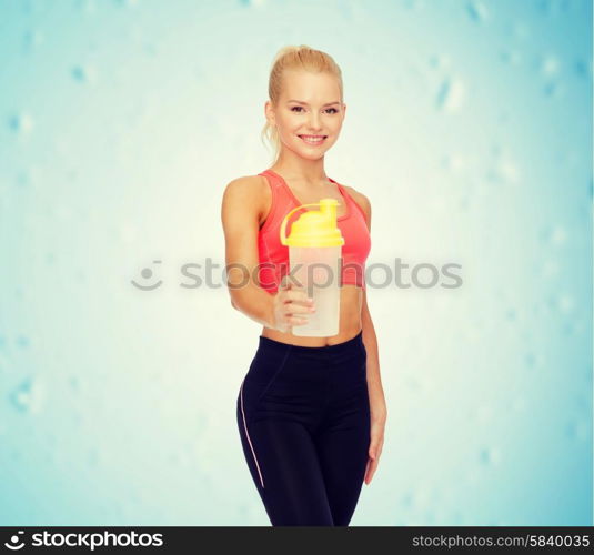 sport, fitness and diet concept - smiling sporty woman with protein shake bottle