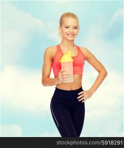 sport, fitness and diet concept - smiling sporty woman with protein shake bottle