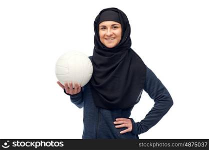sport, fitness and people concept - happy muslim woman in hijab with volleyball