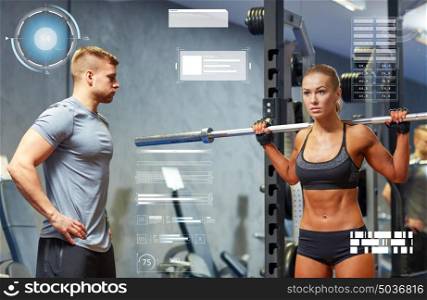 sport, fitness, bodybuilding, exercising and people concept - man and woman with barbell flexing muscles in gym over virtual charts. man and woman with barbell flexing muscles in gym