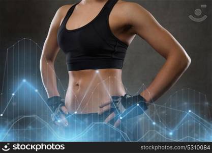sport, fitness, bodybuilding, sportswear and people concept - young woman body in gym. young woman body in gym