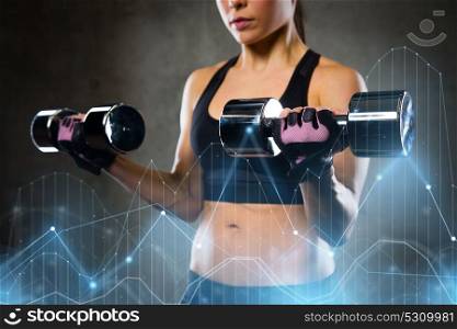 sport, fitness, bodybuilding, weightlifting and people concept - woman flexing arms with dumbbell in gym. woman flexing arms with dumbbells
