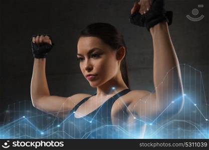 sport, fitness, bodybuilding, weightlifting and people concept - young woman flexing muscles in gym. young woman flexing muscles in gym