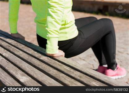 sport, fitness, exercise and lifestyle concept - woman doing sports outdoors