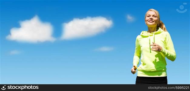 sport, fitness, exercising, people and lifestyle concept - female runner jogging over blue sky and clouds background