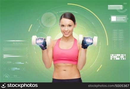 sport, fitness, exercising, technology and people concept - happy young sporty woman with dumbbells flexing biceps over green background. happy sporty woman with dumbbells flexing biceps