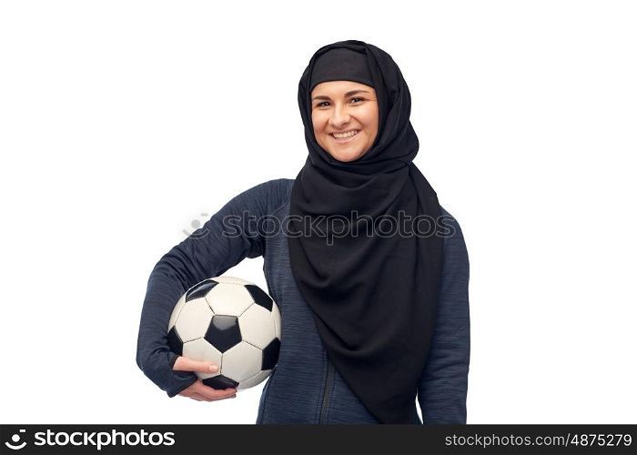 sport, fitness, football and people concept - happy muslim woman in hijab with soccer ball