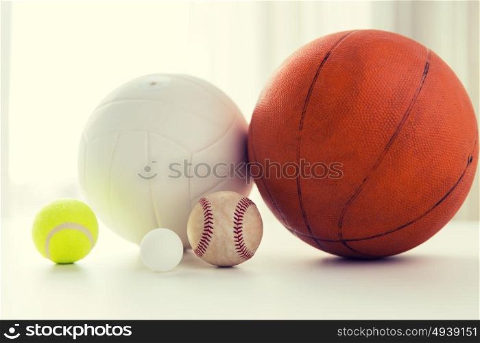sport, fitness, game and objects concept - close up of different sports balls set. close up of different sports balls set