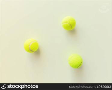 sport, fitness, game and objects concept - close up of three yellow tennis balls. close up of three yellow tennis balls