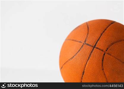 sport, fitness, game, sports equipment and objects concept - close up of basketball ball