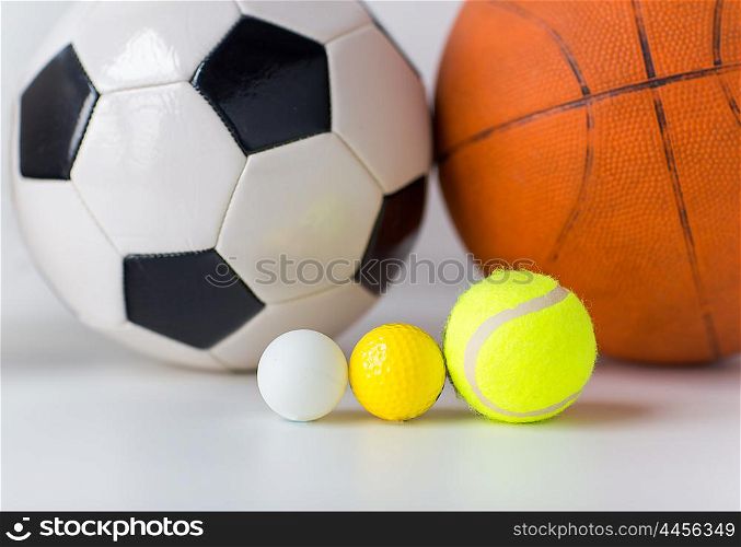 sport, fitness, game, sports equipment and objects concept - close up of different sports balls set