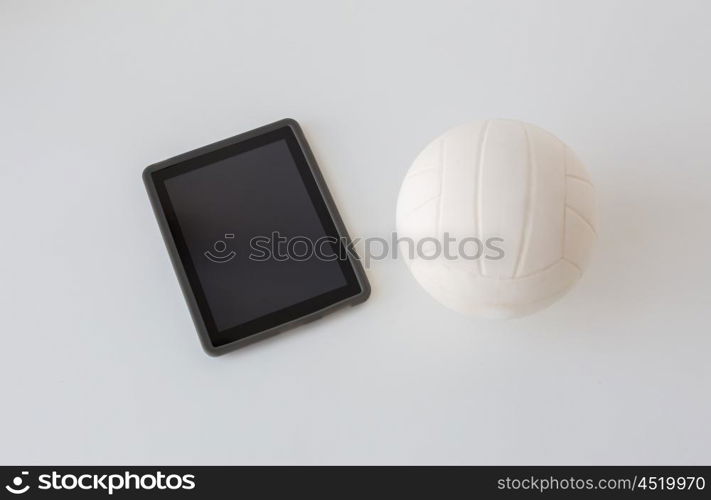 sport, fitness, game, sports equipment and technology concept - close up of volleyball ball and tablet pc computer with black blank screen on white background