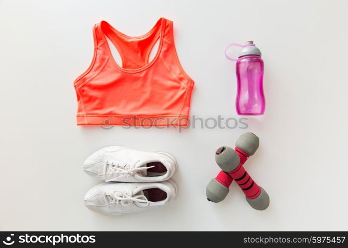 sport, fitness, healthy lifestyle and objects concept - close up of female sports clothing, dumbbells and bottle set