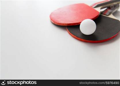 sport, fitness, healthy lifestyle and objects concept - close up of ping-pong or table tennis rackets with ball