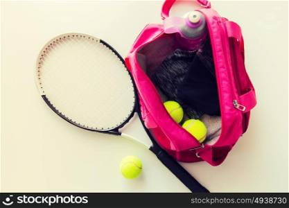 sport, fitness, healthy lifestyle and objects concept - close up of tennis racket and balls with female sports bag. close up of tennis stuff and female sports bag