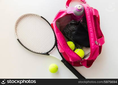 sport, fitness, healthy lifestyle and objects concept - close up of tennis racket and balls with female sports bag