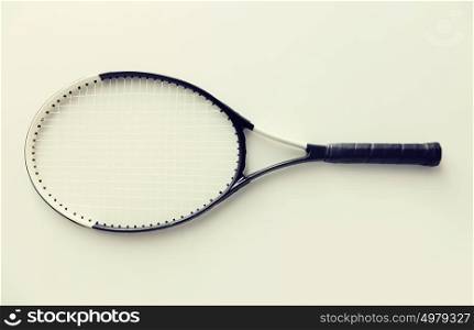 sport, fitness, healthy lifestyle and objects concept - tennis racket