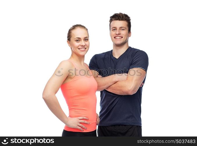 sport, fitness, lifestyle and people concept - happy sportive man and woman. happy sportive man and woman