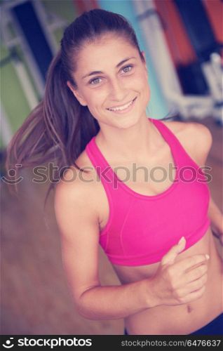 sport, fitness, lifestyle, technology and people concept - smiling woman exercising on treadmill in gym. woman exercising on treadmill in gym