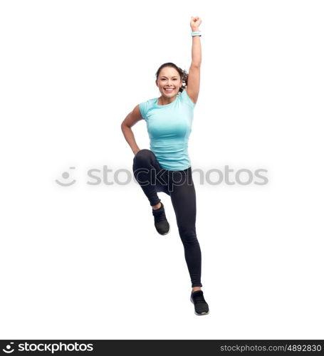 sport, fitness, motion and people concept - happy smiling young woman jumping in superhero pose over white background