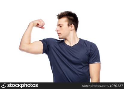 sport, fitness, power, strength and people concept - sportive man showing bicep. sportive man showing bicep power