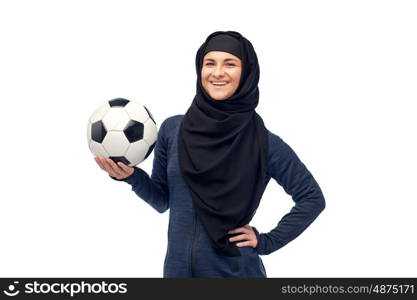 sport, fitness, soccer and people concept - happy muslim woman in hijab with football